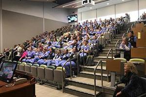 Continuing Medical and Nursing Education students in a D-H auditorium